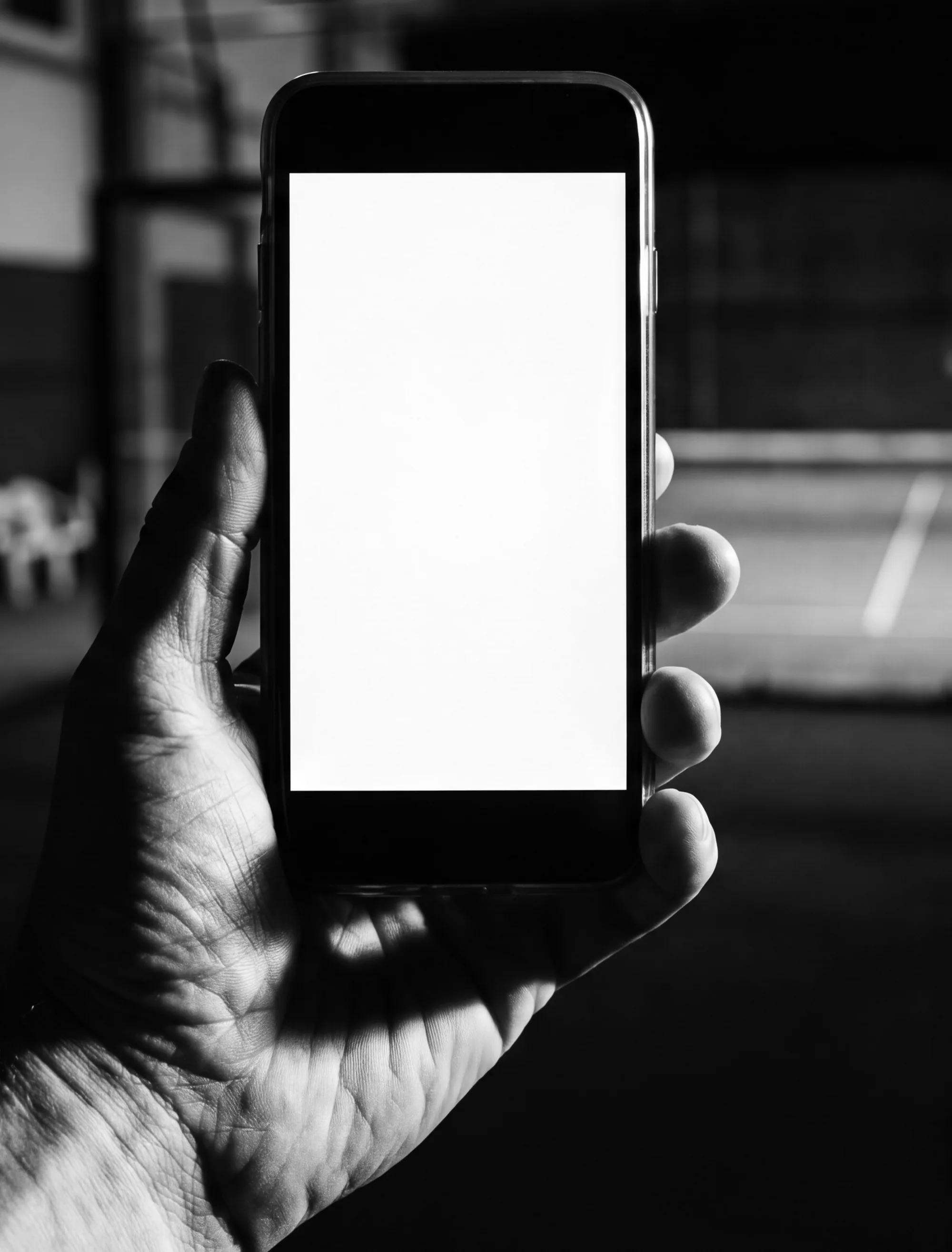 A hand holding a phone showing the Padel 88 page in the Playtomic app.